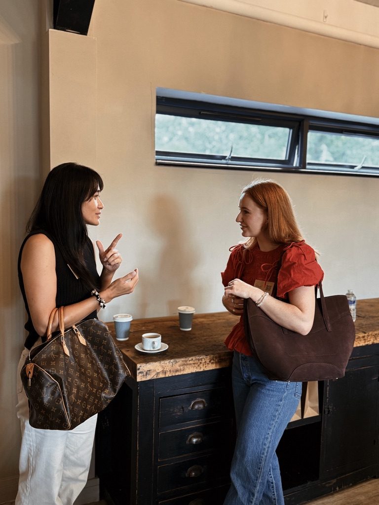 Claudia in conversation at a networking event