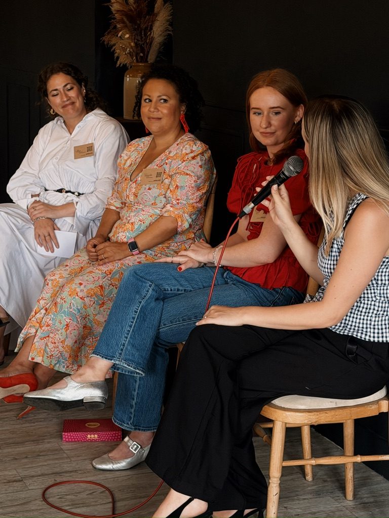 Claudia on a panel with other founders